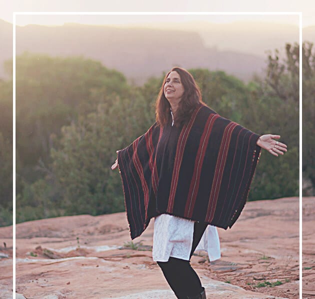 Photo of HeatherAsh in poncho with arms outstretched