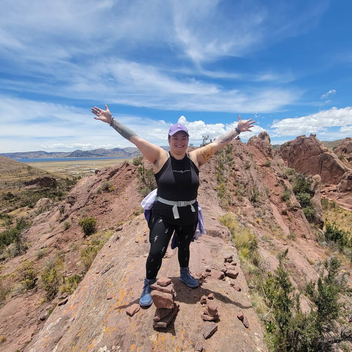 Sarina_mountain top arms out
